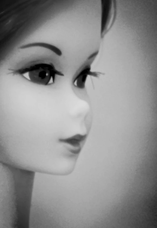 a black and white po of an barbie doll