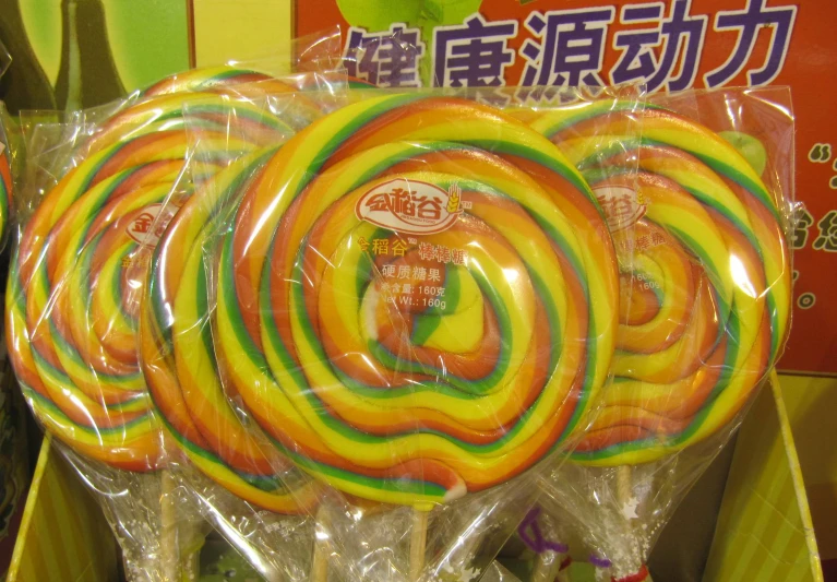 there is a box with four large lollipops on it