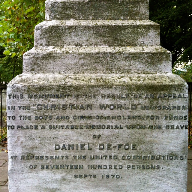 a stone monument with the names and number of places in it