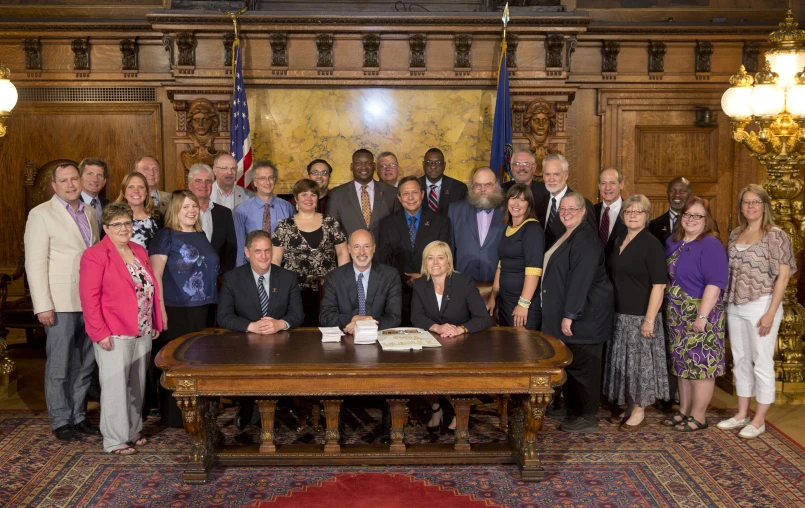 a large group of people posing for a po