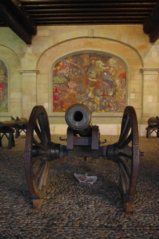 a cannon is sitting in the center of a large room