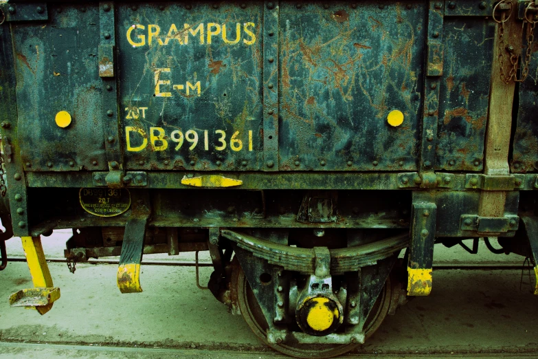 a closeup view of a green train car