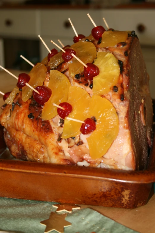 food on a wooden plate that has fruit on it