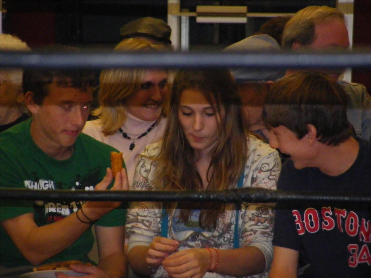 several people watching an audience in a sporting area