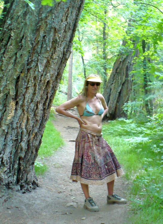 a woman in a bikini poses for a po