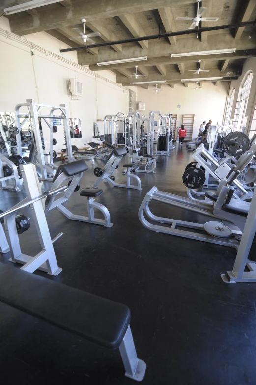 a gym with all sorts of machines, weights and machines