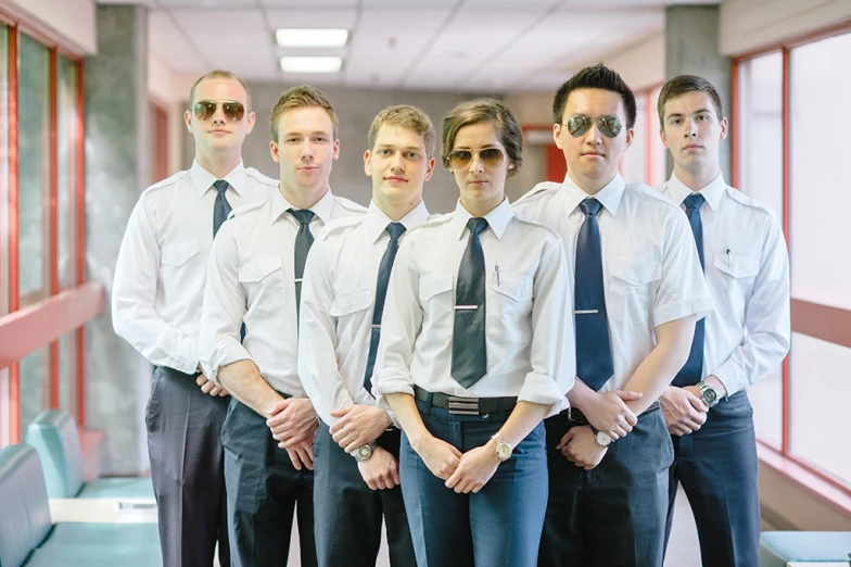 a group of young men in ties and dress shirts