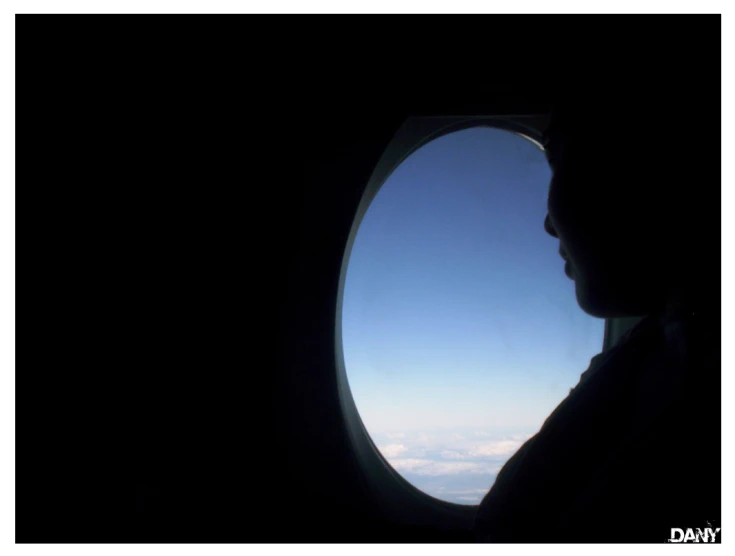 a view of clouds through an airplane window