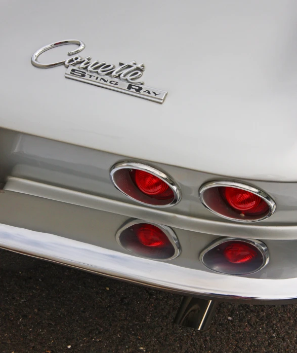 the taillights on a classic car are visible