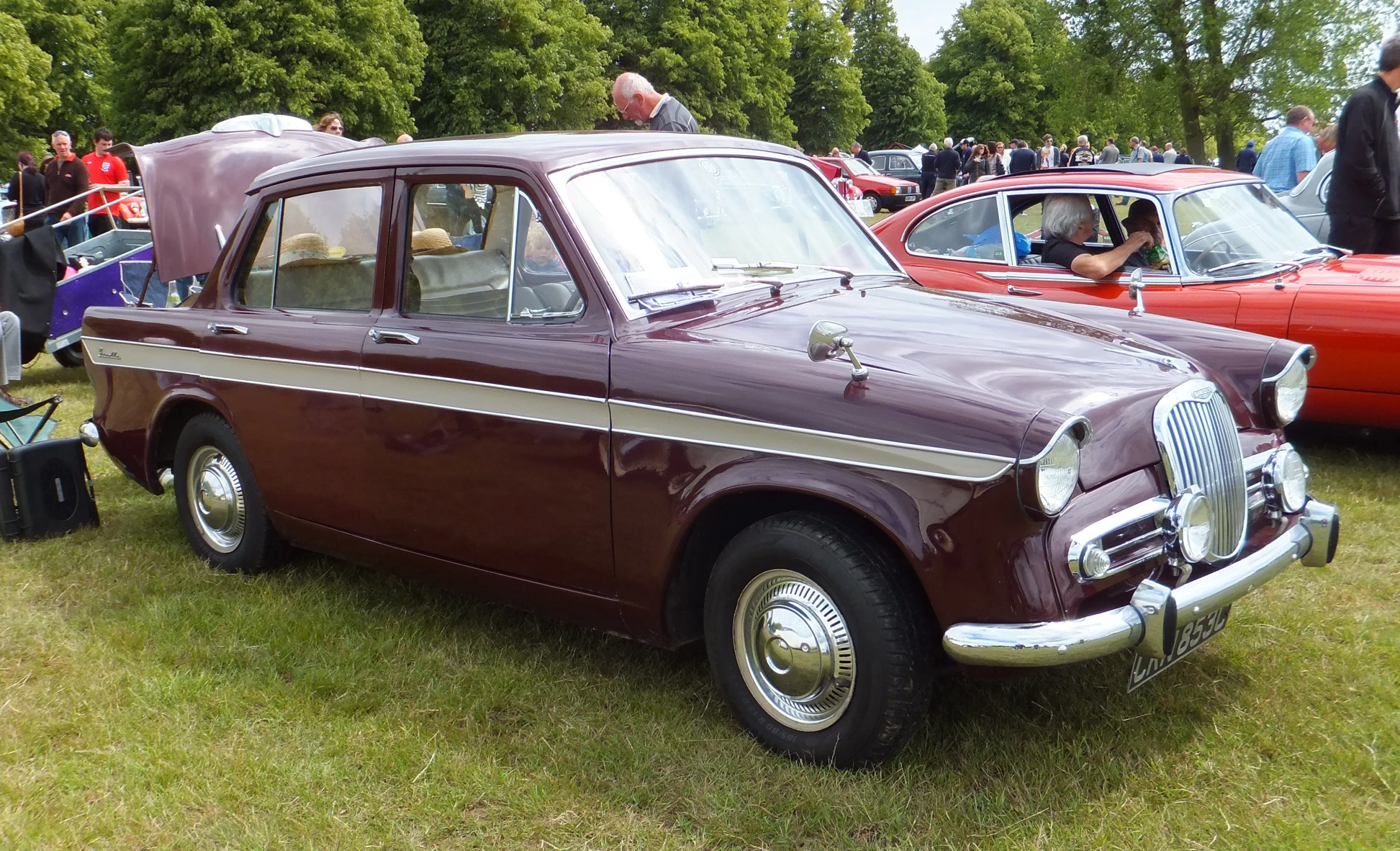 a number of cars on display at a car show