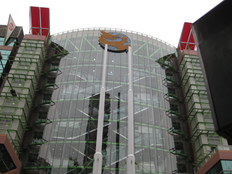 a large glass building sitting on top of a street