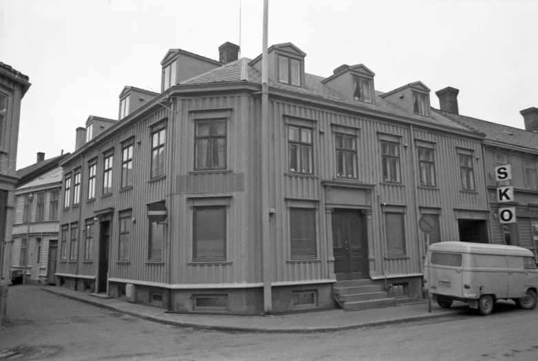 the large building has several windows and a sign on it