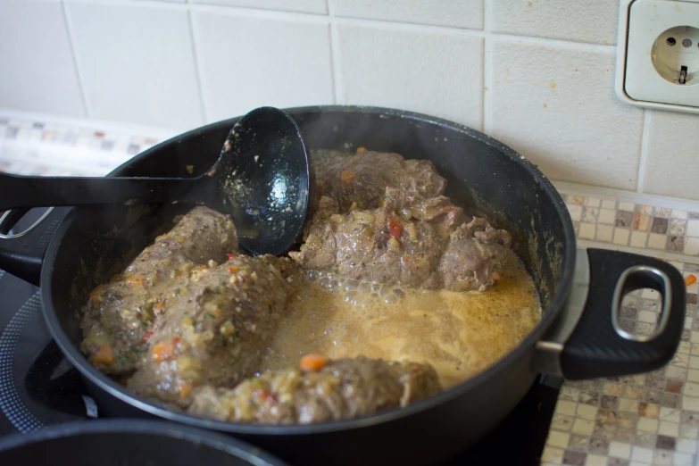 a very large pot on top of a stove