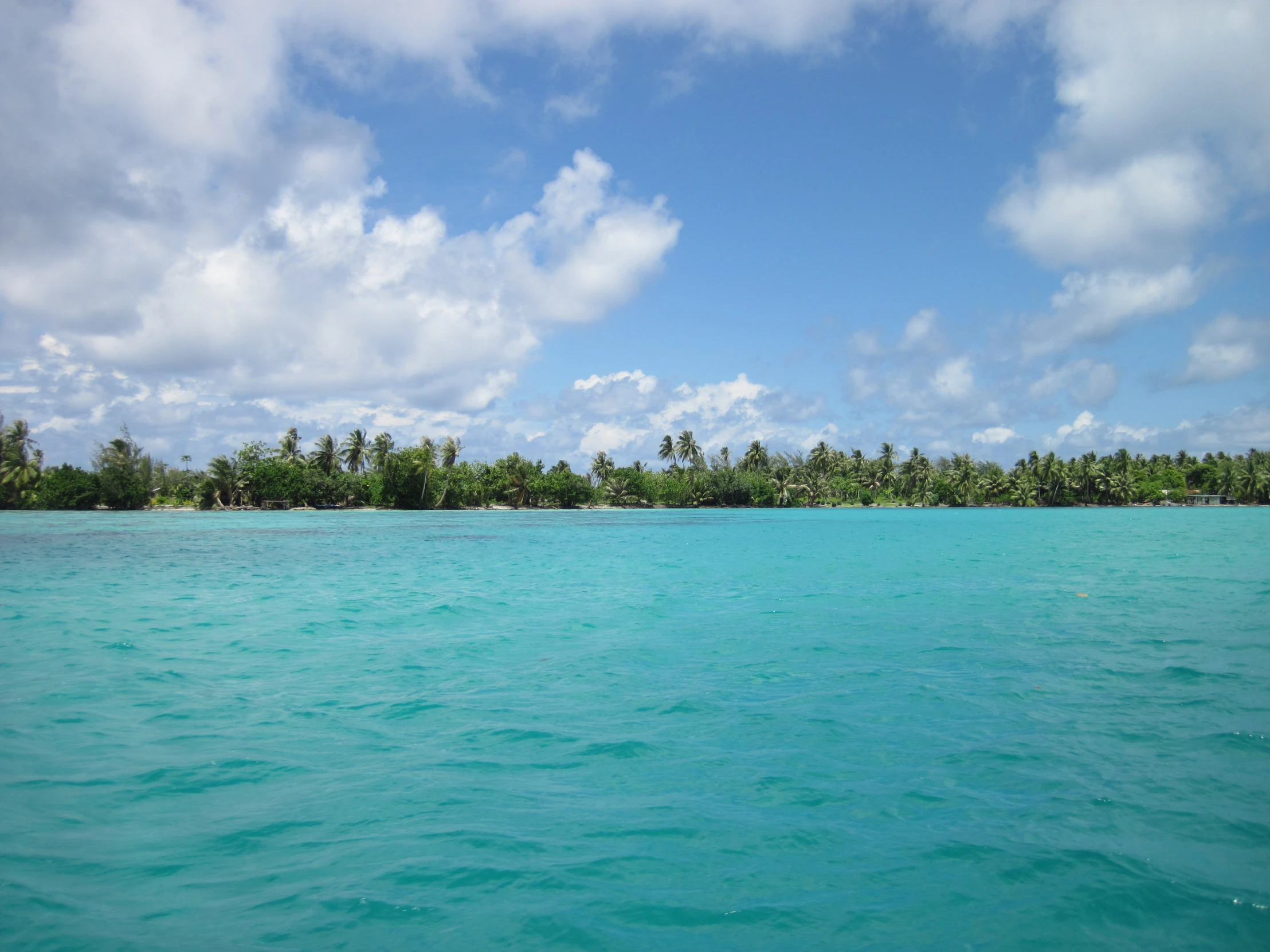 a body of water with a boat in the middle