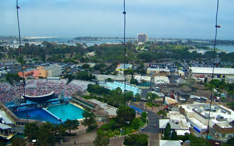 an aerial view from a building overlooking a large pool and resort