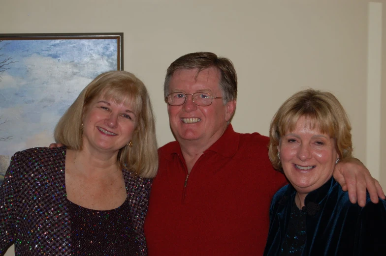 two older adults standing next to an old lady