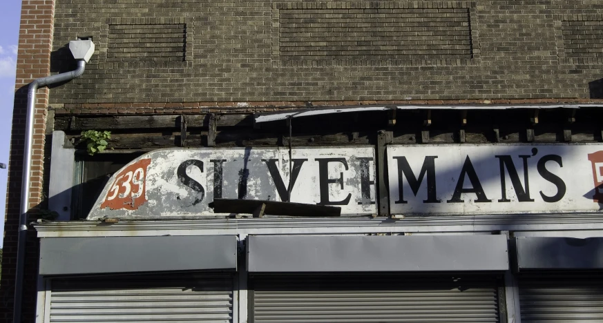 an old sign is in the window of the store