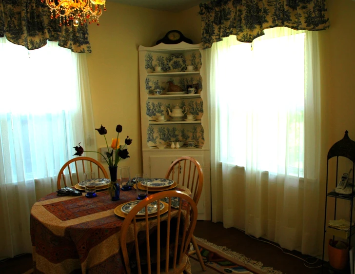 a table with chairs in the dining room