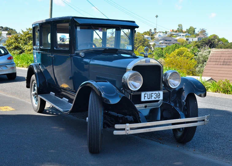 a classic automobile is parked in the parking lot
