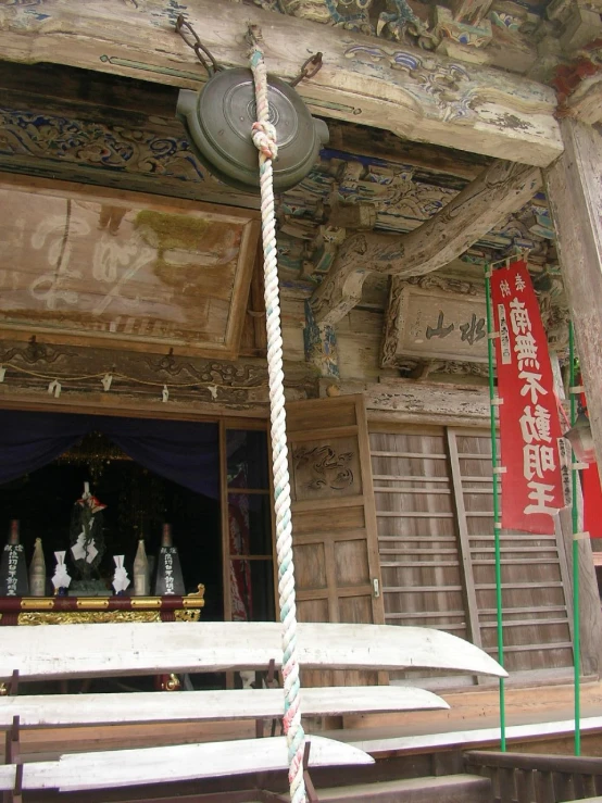 some white benches and lights at an oriental temple