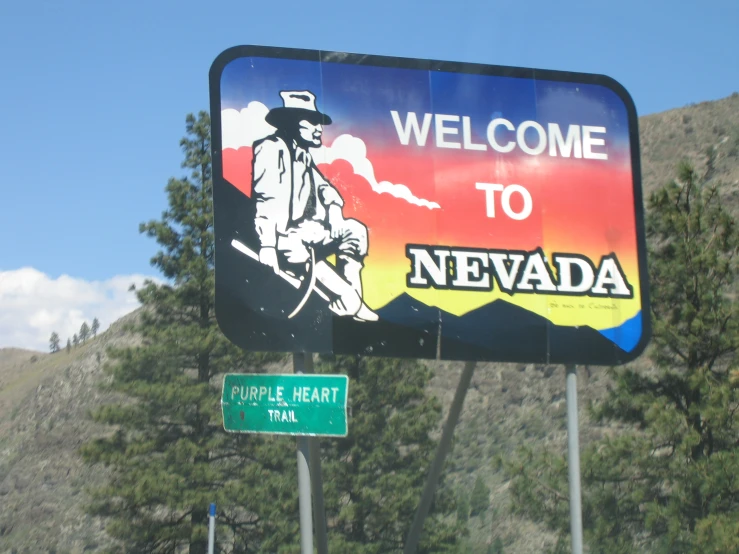 a welcome to nevada sign on the highway