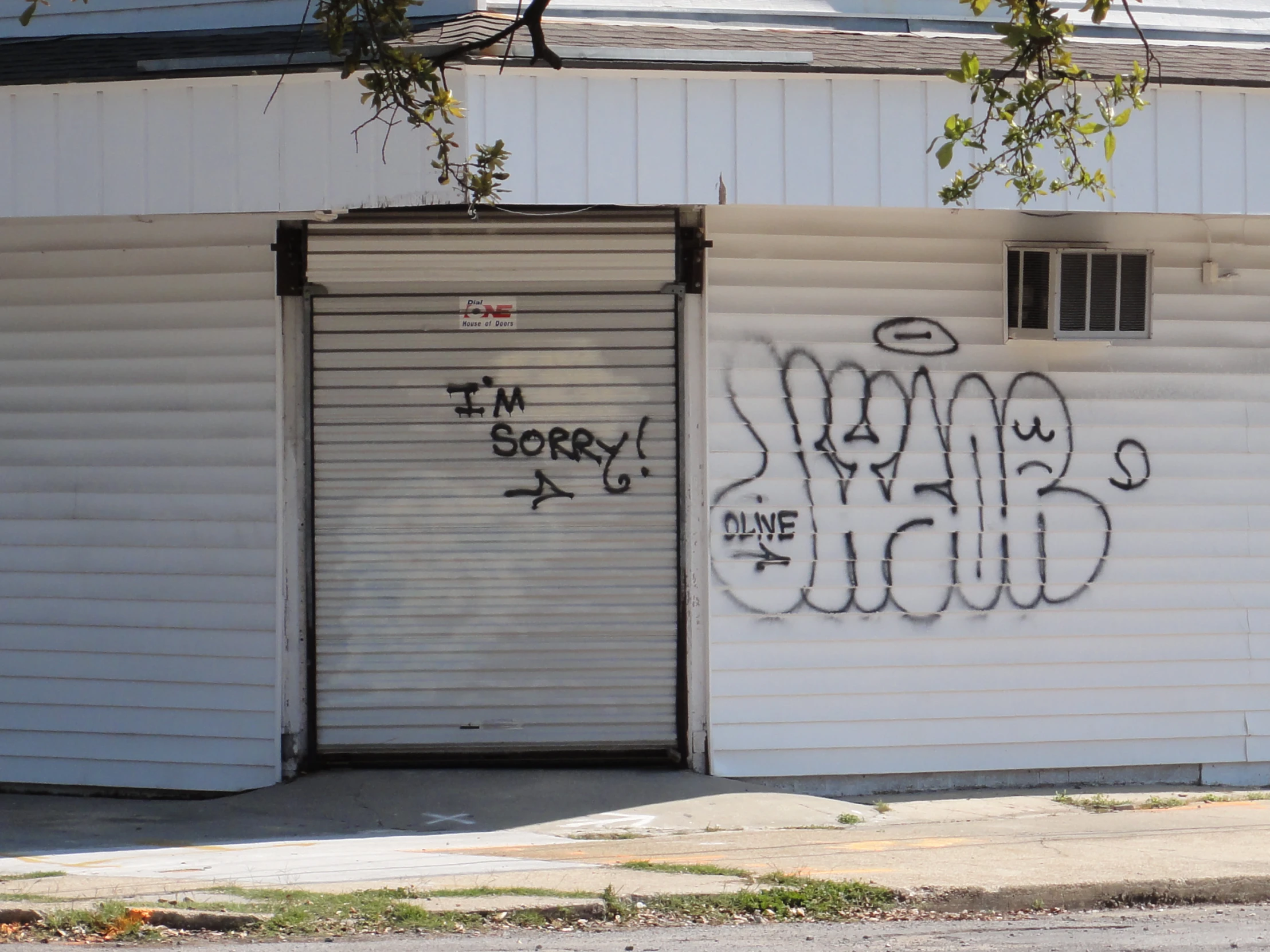 a garage with graffiti on the side of it