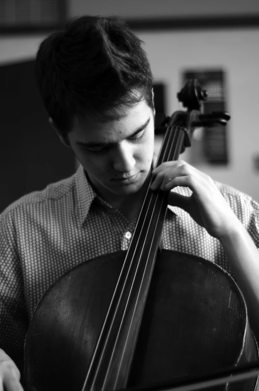 a black and white po of a man with an instrument