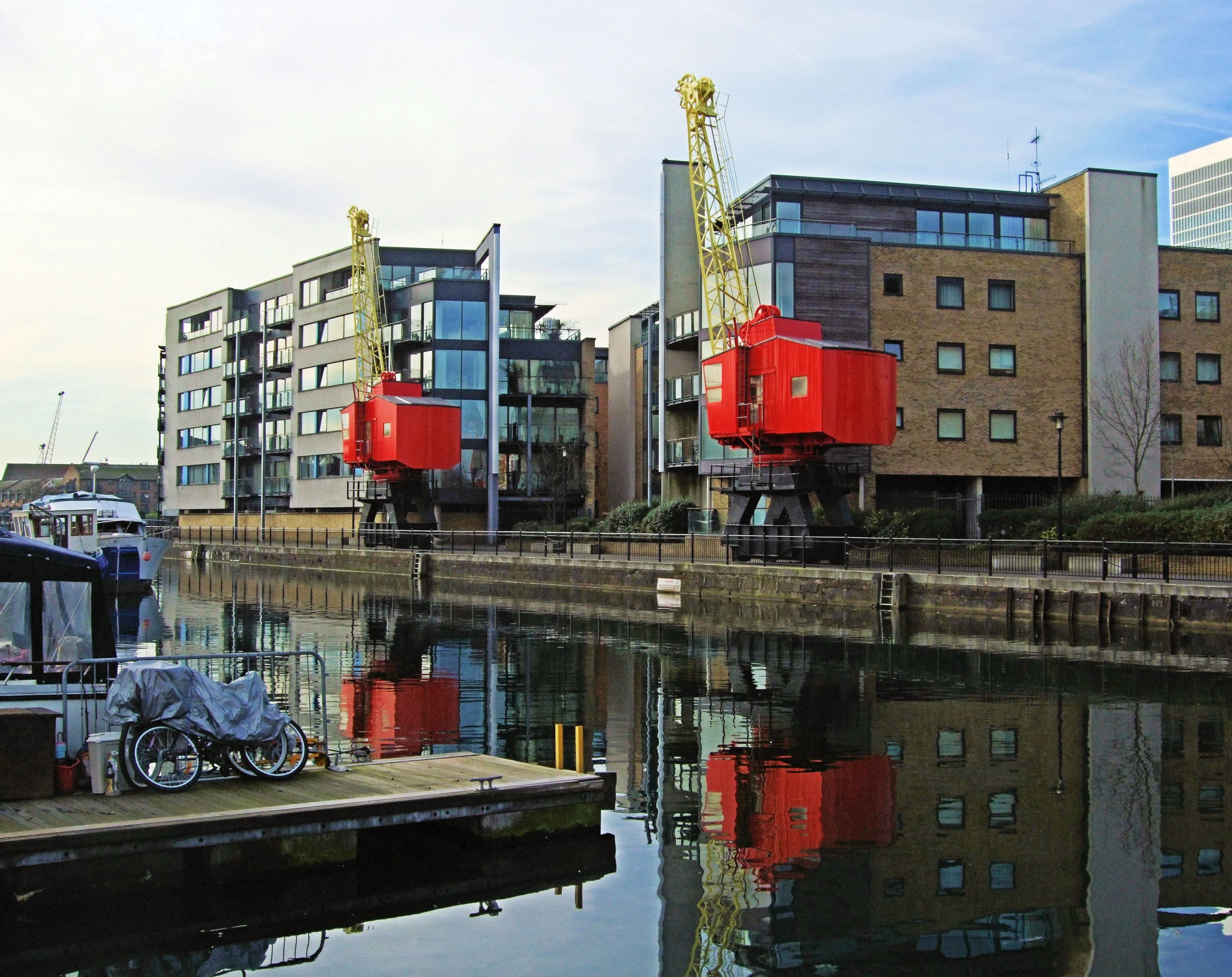 a view of a canal near a city with tall buildings