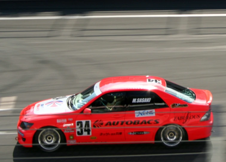 a red race car with number 24 on the front