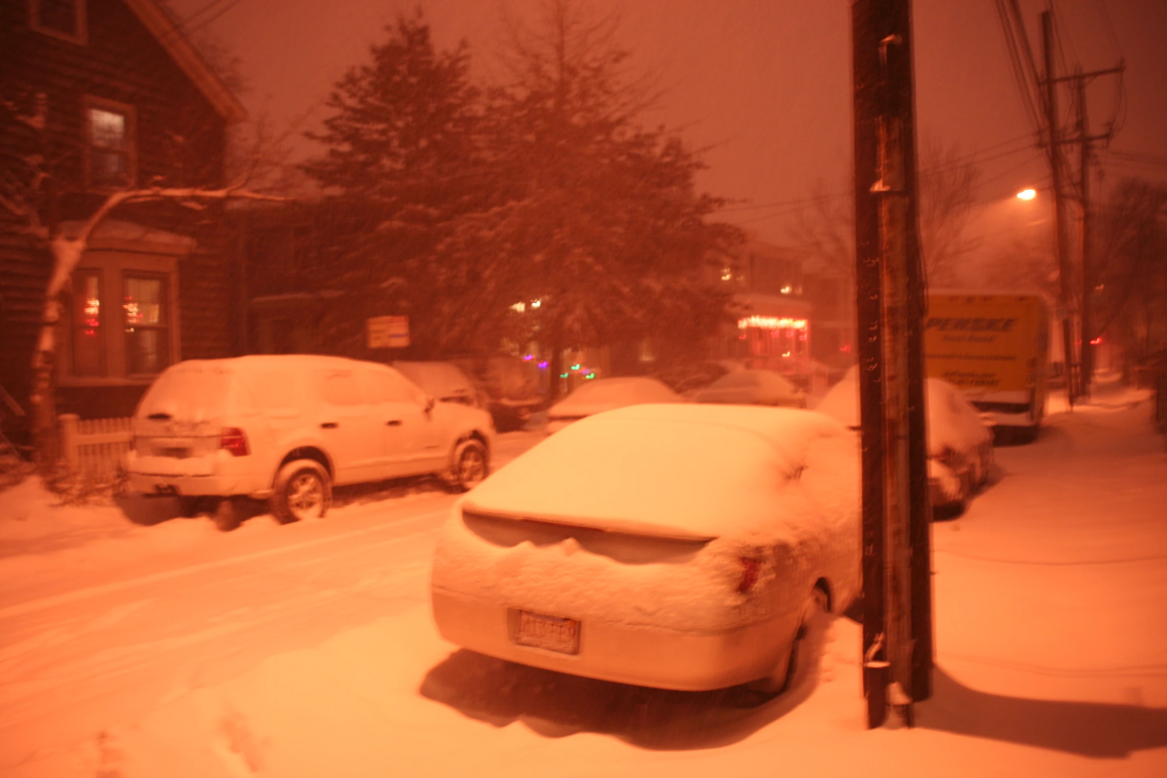 a car is covered with a thick coat of snow