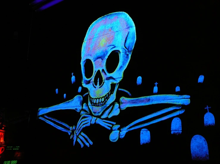 there is a lit up skeleton with a bow tie