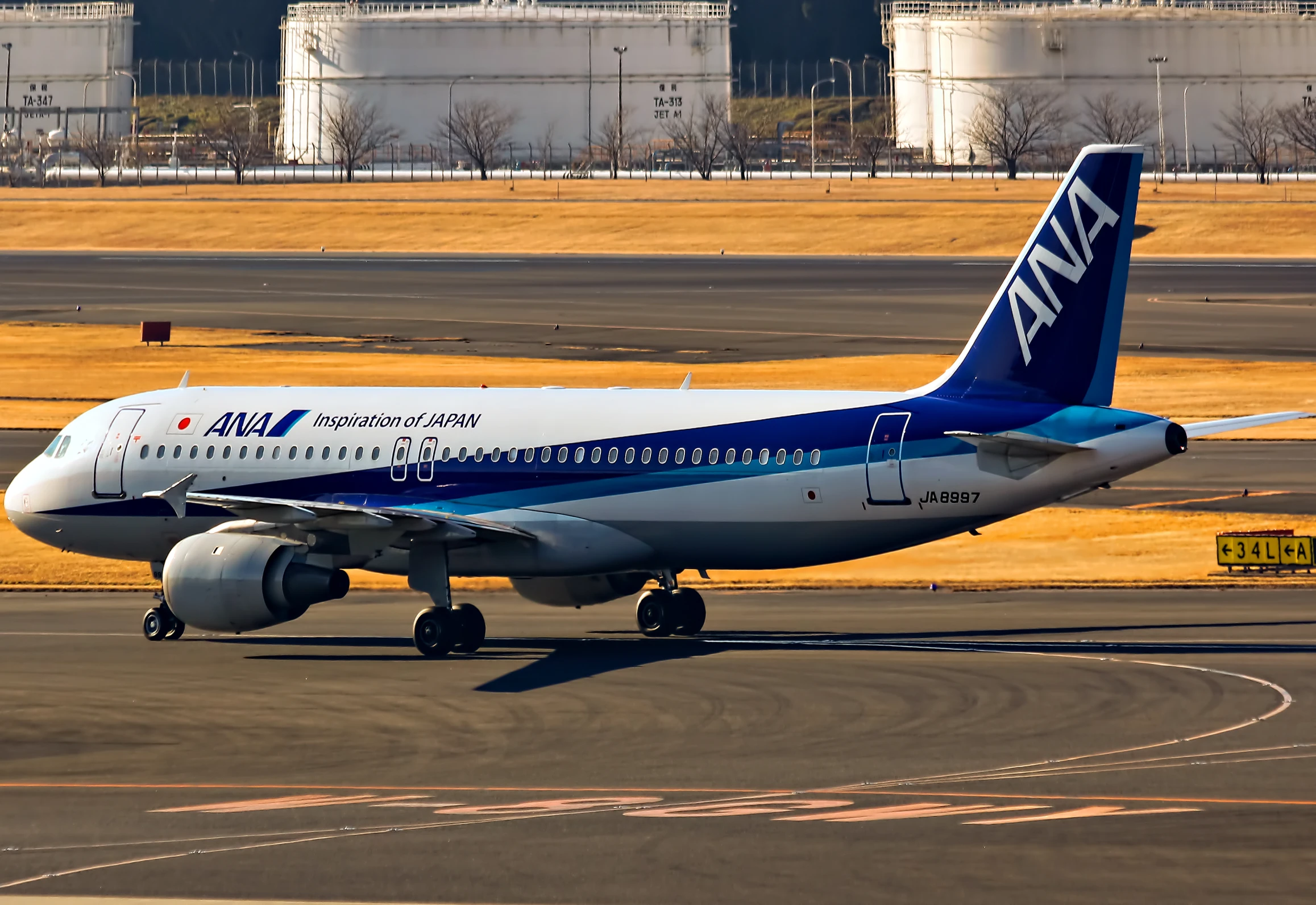 the airplane is painted blue and white, but still has wheels down