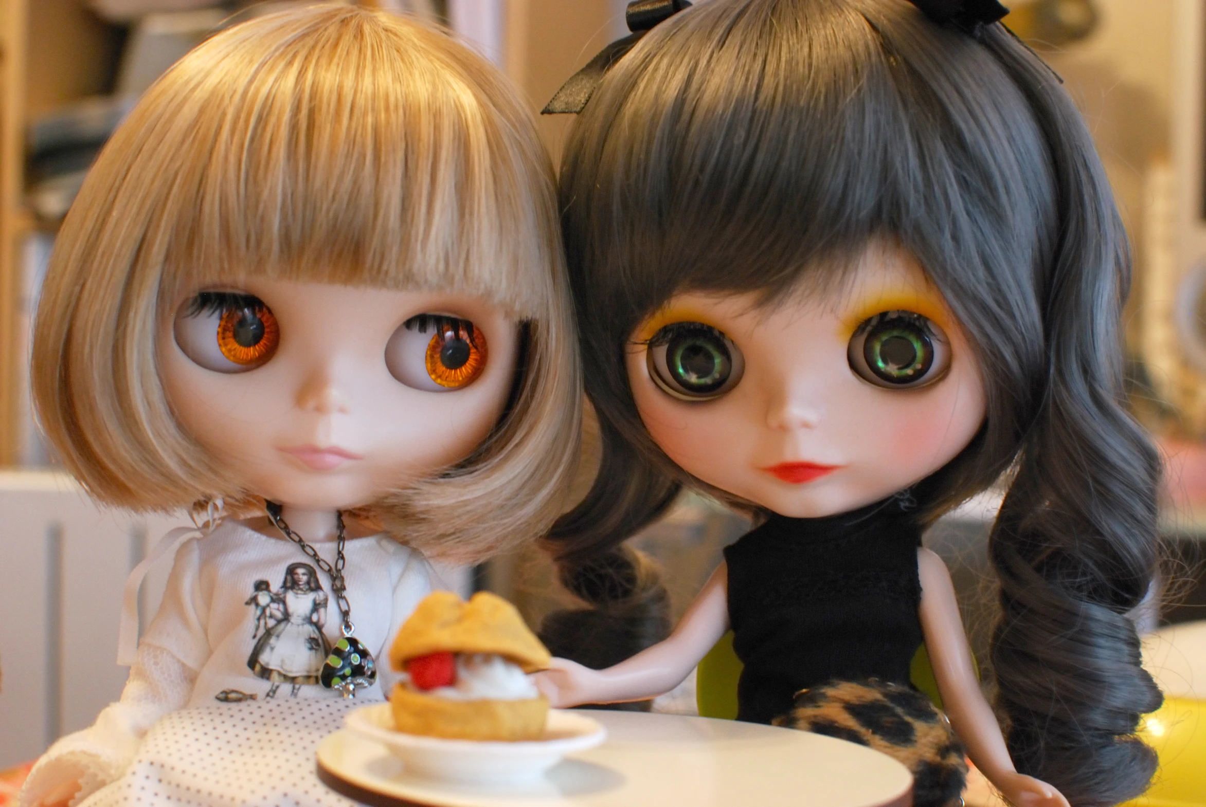 a couple of dolls sitting next to each other