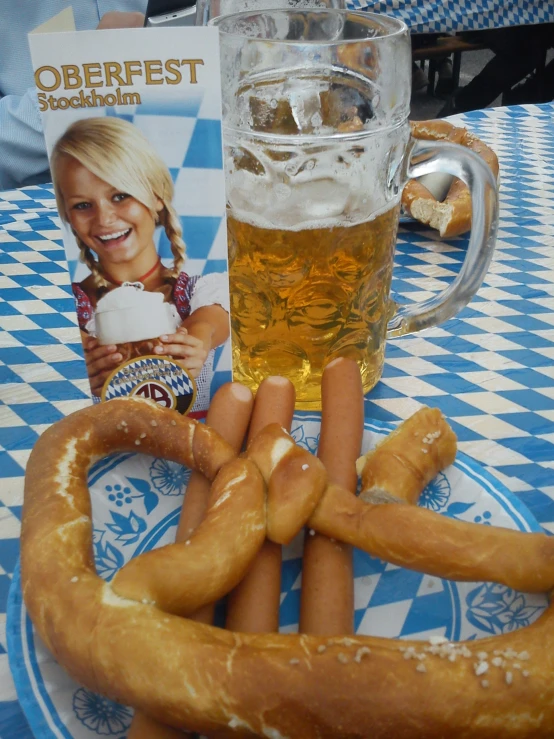 two  dogs sitting next to beer on a table