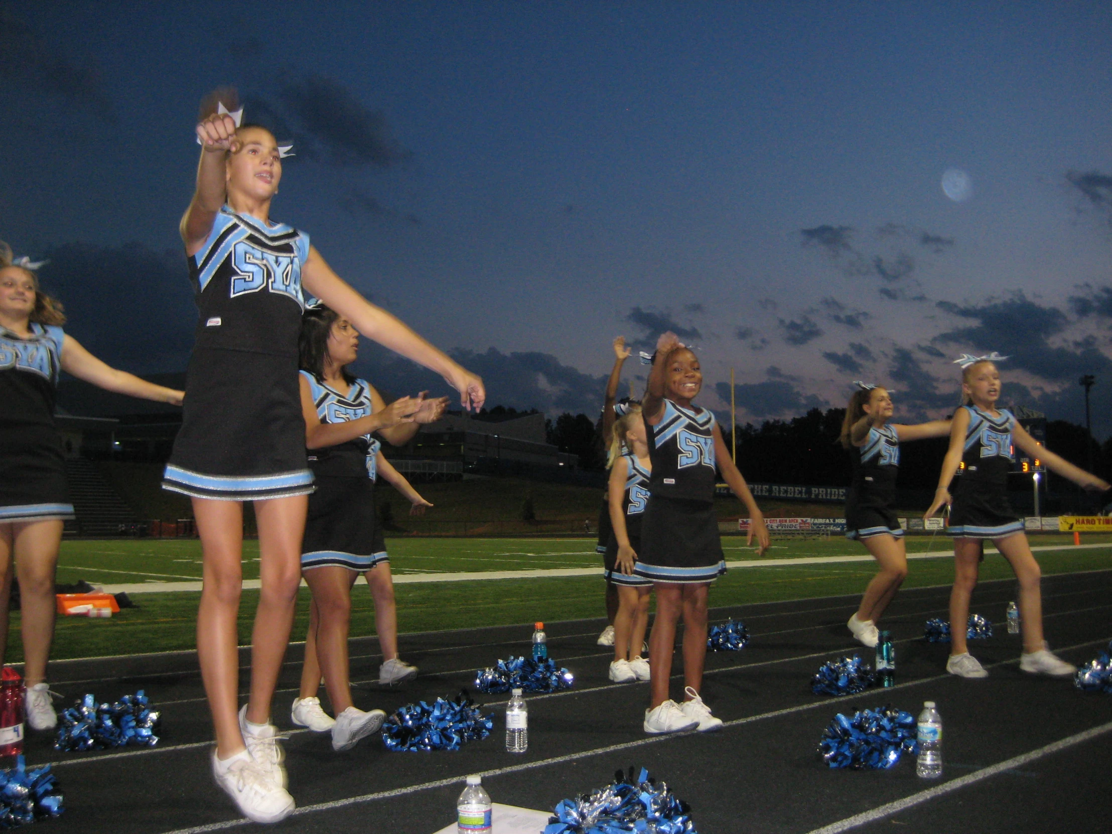 a group of cheerleaders are performing for the crowd