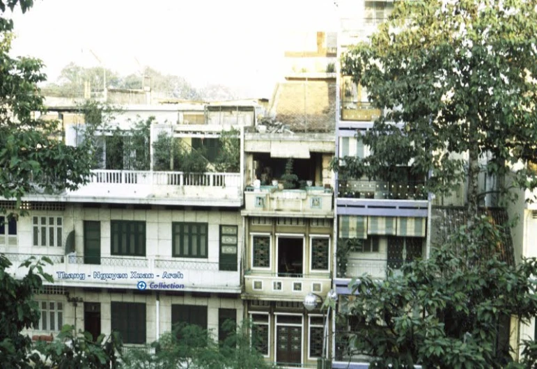 a tall, multi - story building with many balconies and balconies