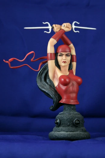 an image of a statue that appears to be woman holding two swords