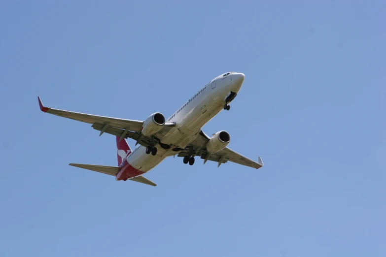 a large passenger jet flying through a blue sky