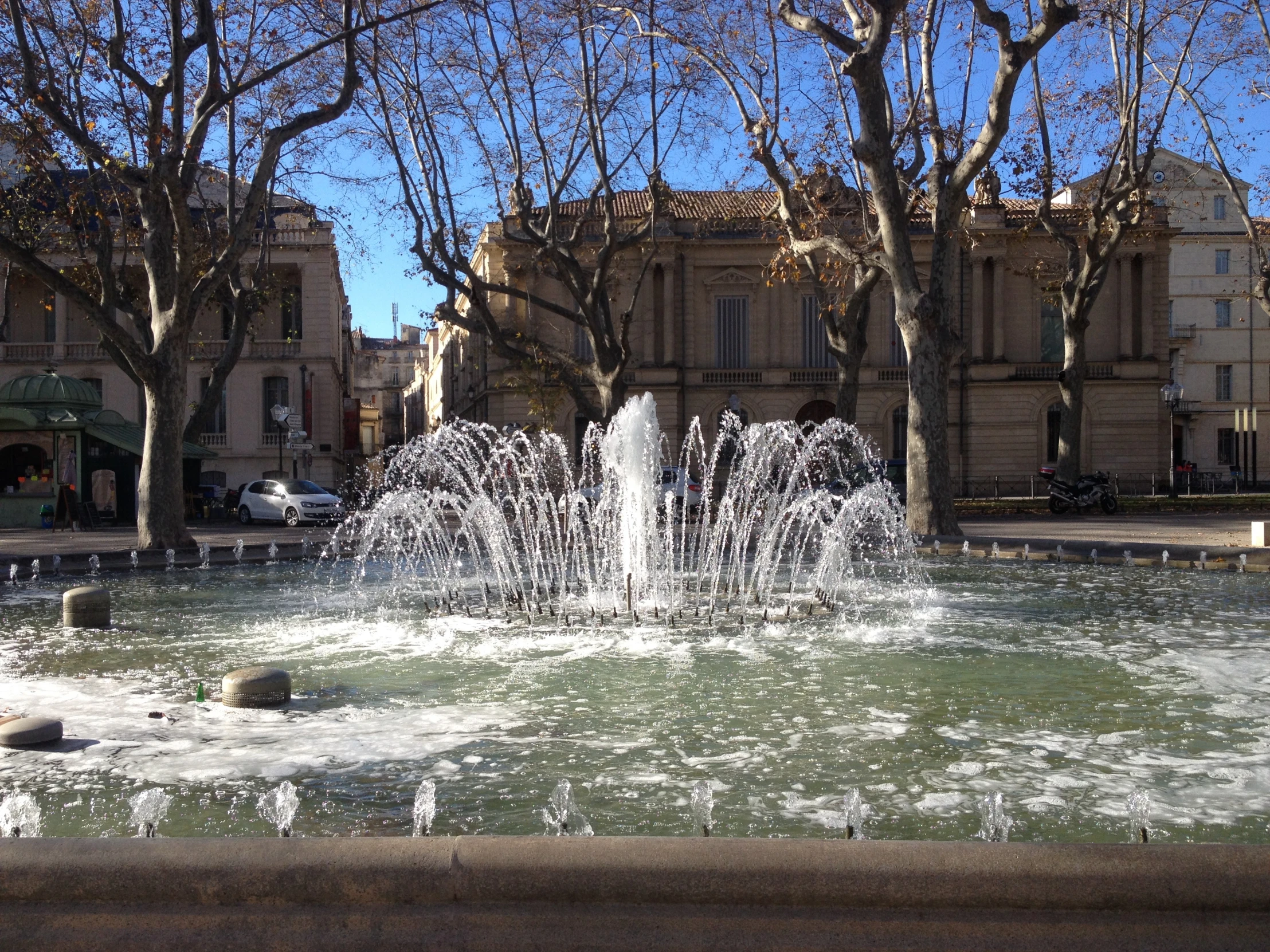 a small fountain near a plaza of some sort