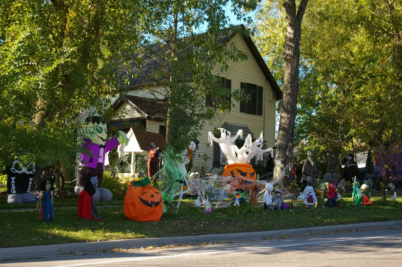 many people are on a lawn with decorations