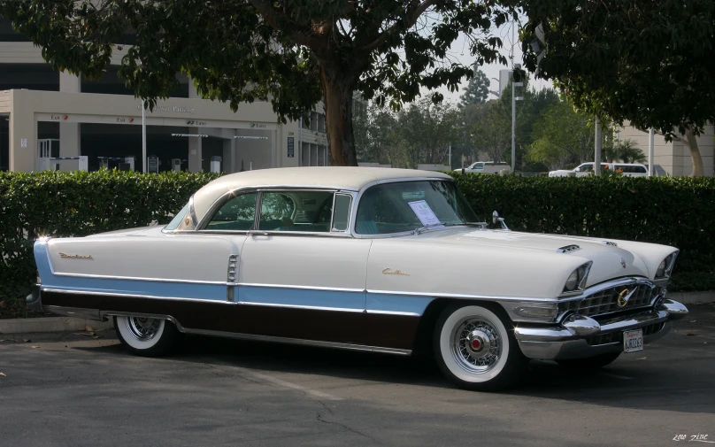 a classic car parked on the side of the road