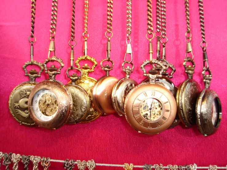 a bunch of different types of pocket watches