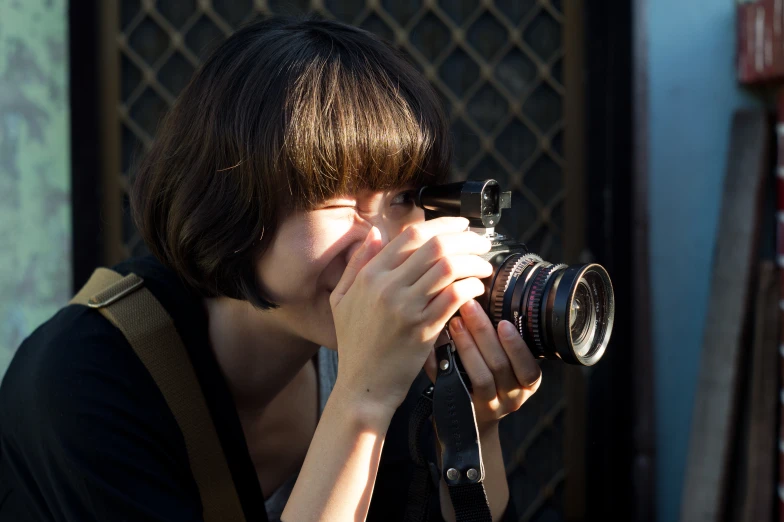 a woman taking a po with her camera