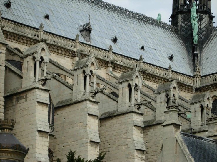 a stone building with many windows and roof