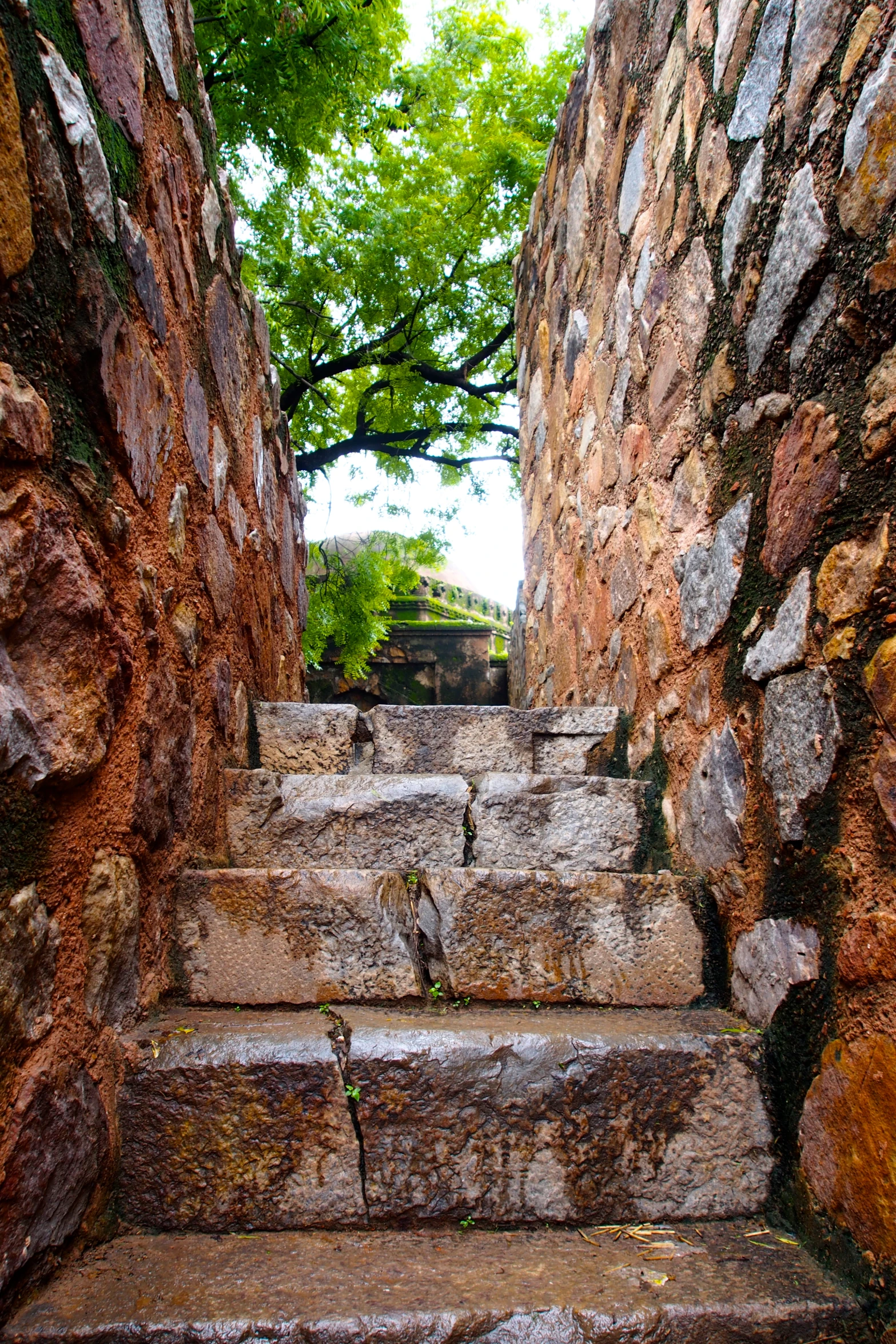 an old stone stairway with some brick steps