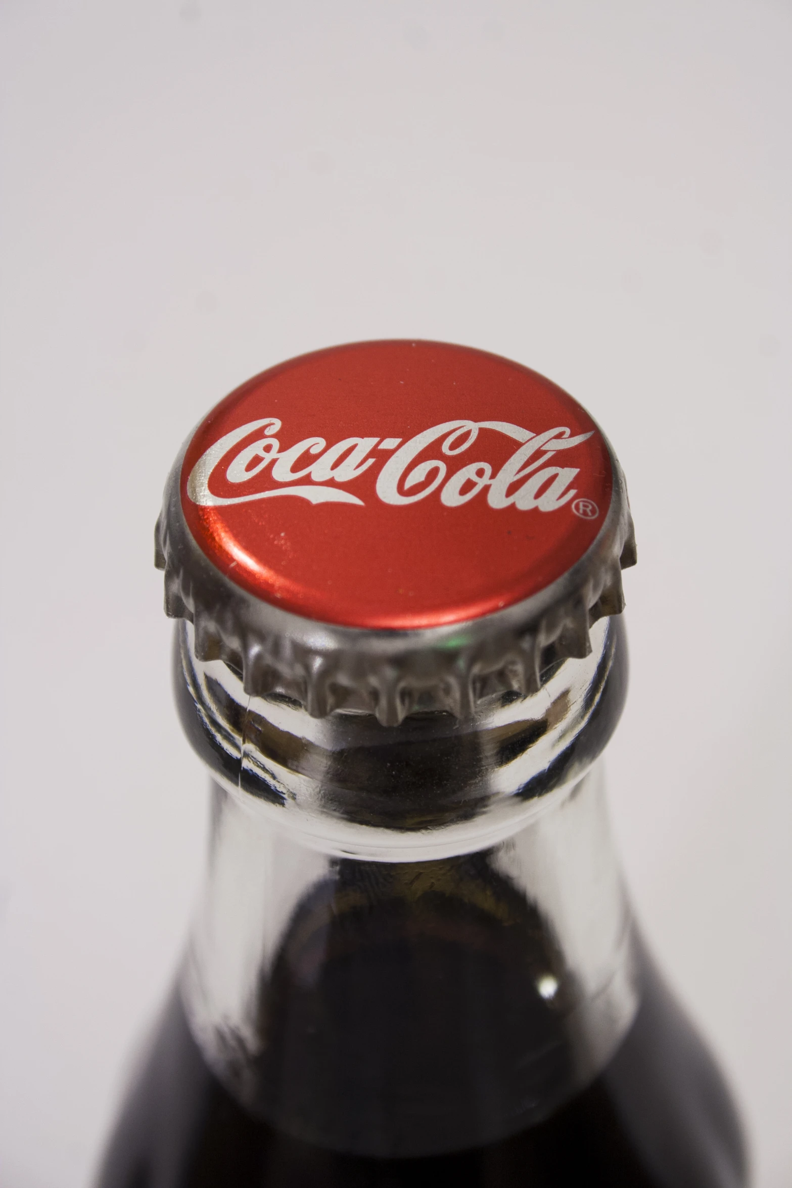 a bottle is shown with a red cap