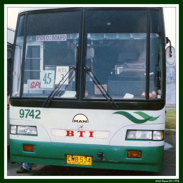 a bus stopped in a lot with the number on the side