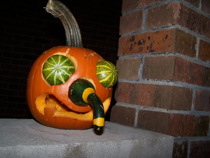 a jack - o'- lantern pumpkin is adorned with gourmet fruit carvings