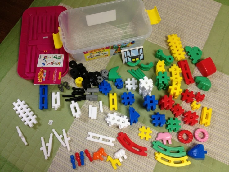 various plastic building toys and construction tools on a table