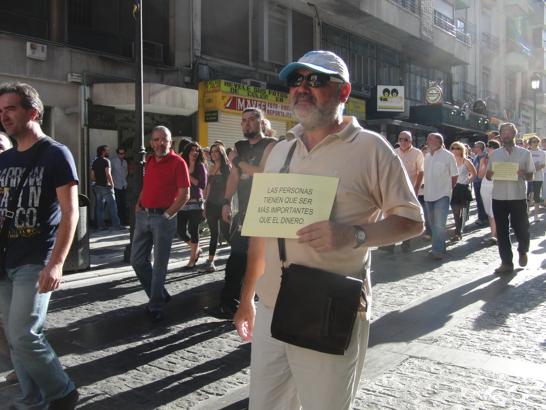 people are walking in the streets holding signs